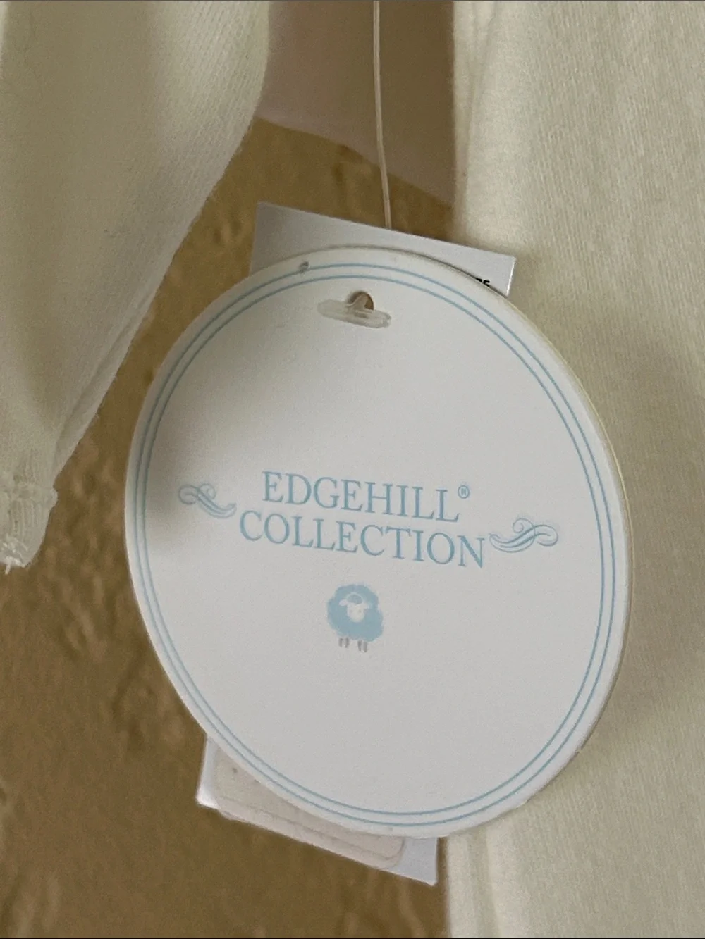 Edgehill Collection Ivory Footed Baby One-Piece with bow detail. NB